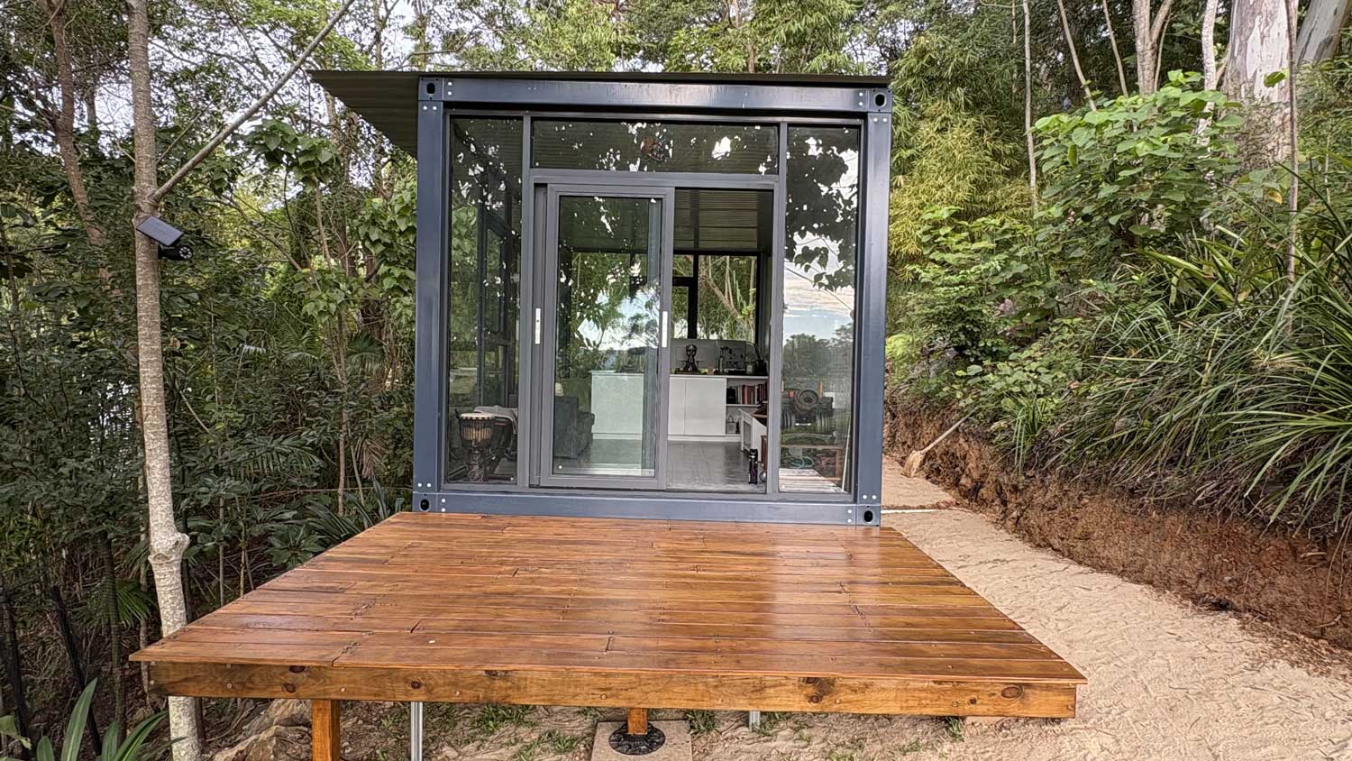 Portable Pod as backyard studio with timber deck and garden setting