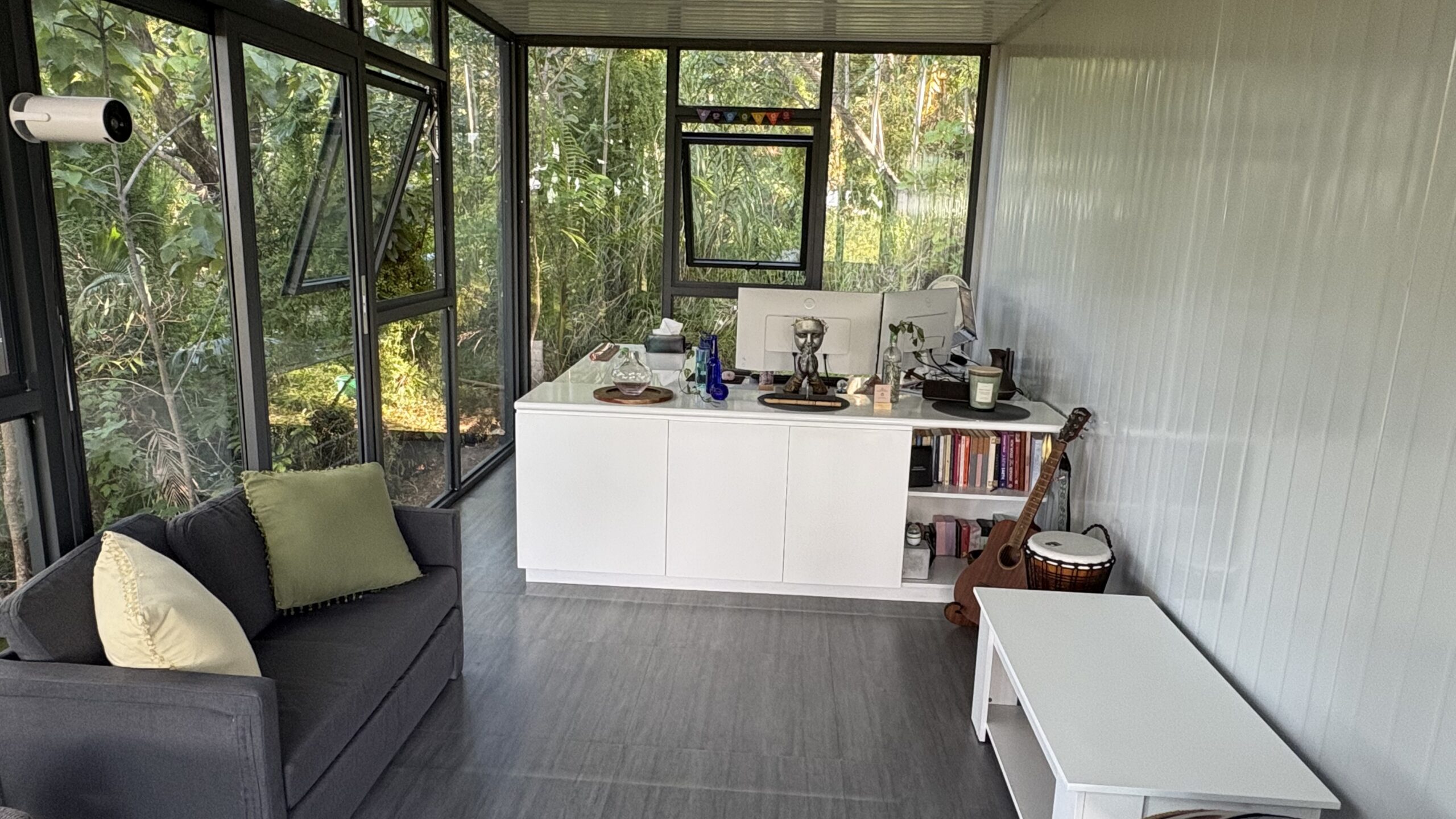 Home office pod interior with desk and natural light